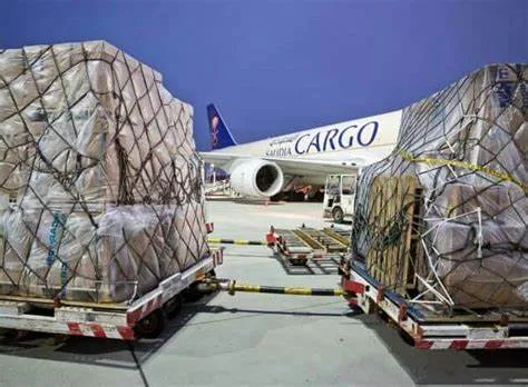 Apricot pallets beside a cargo aircraft